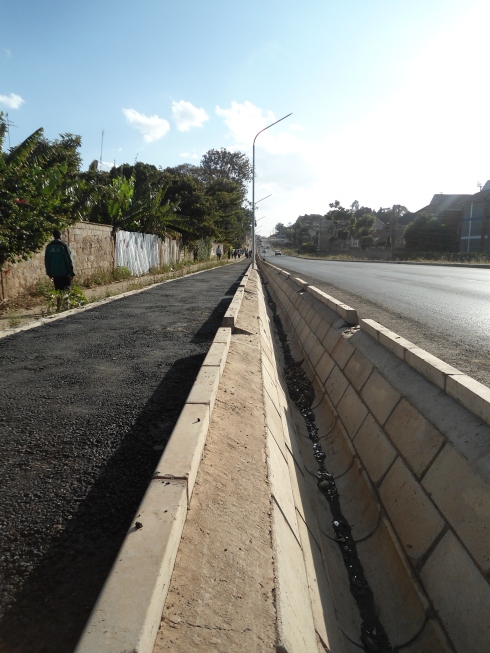 That drainage ditch ensures the cyclist and motorists never meet along Kileleshwa Ring Road