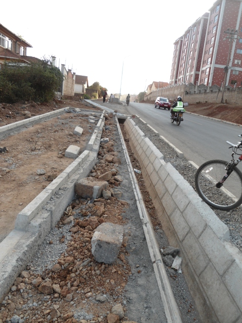 The cycle lane narrows out as it gets "chocked" by the pedestrian foot path and road on Kileleshwa Ring Road